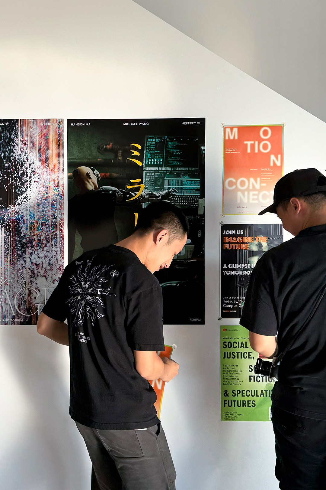 Visitors reading the poster wall